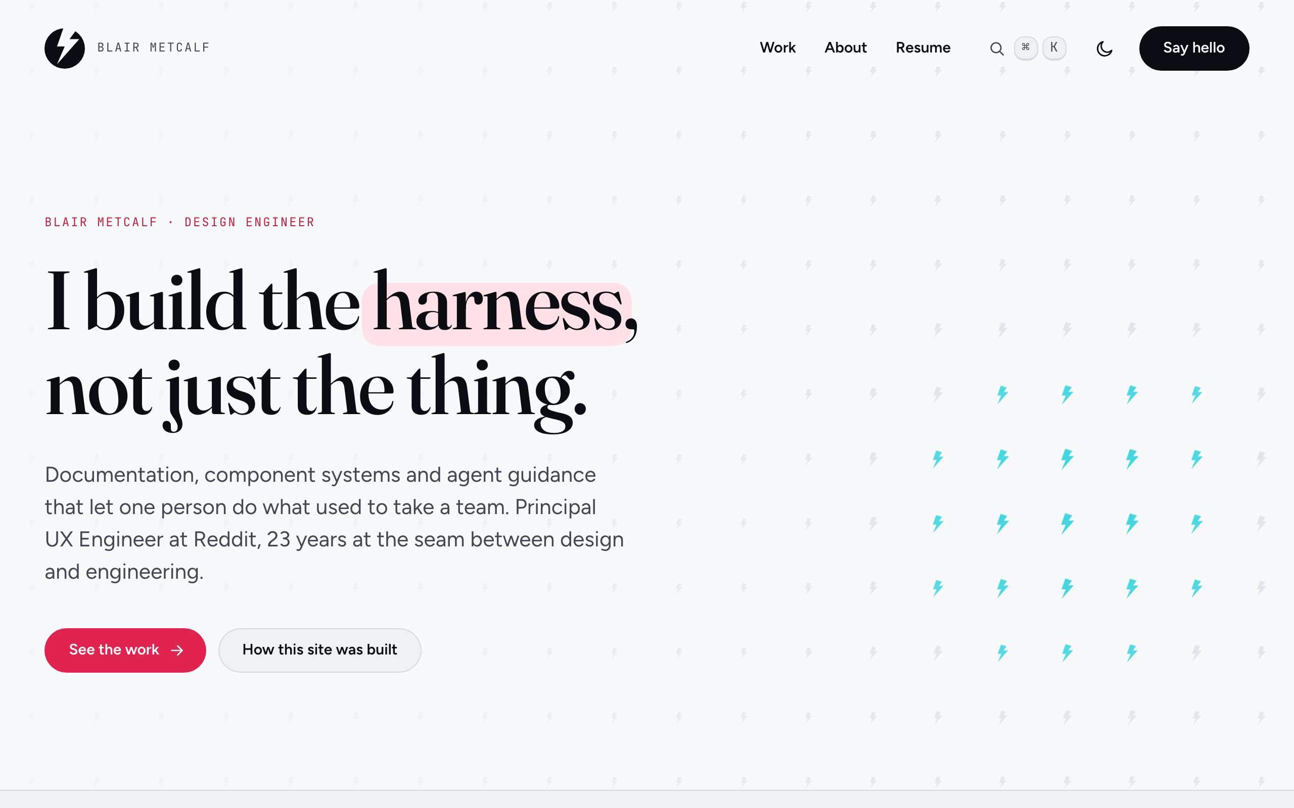 The home page of this site: the line "I build the harness, not just the thing" beside a field of small pink and cyan lightning bolts.